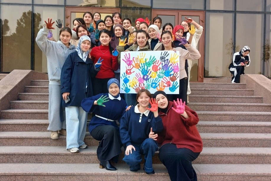 Female student on campus outdoors with a black top 