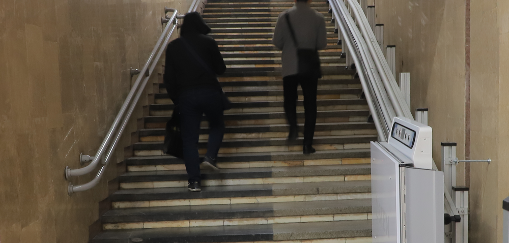 Female student on campus outdoors with a black top 