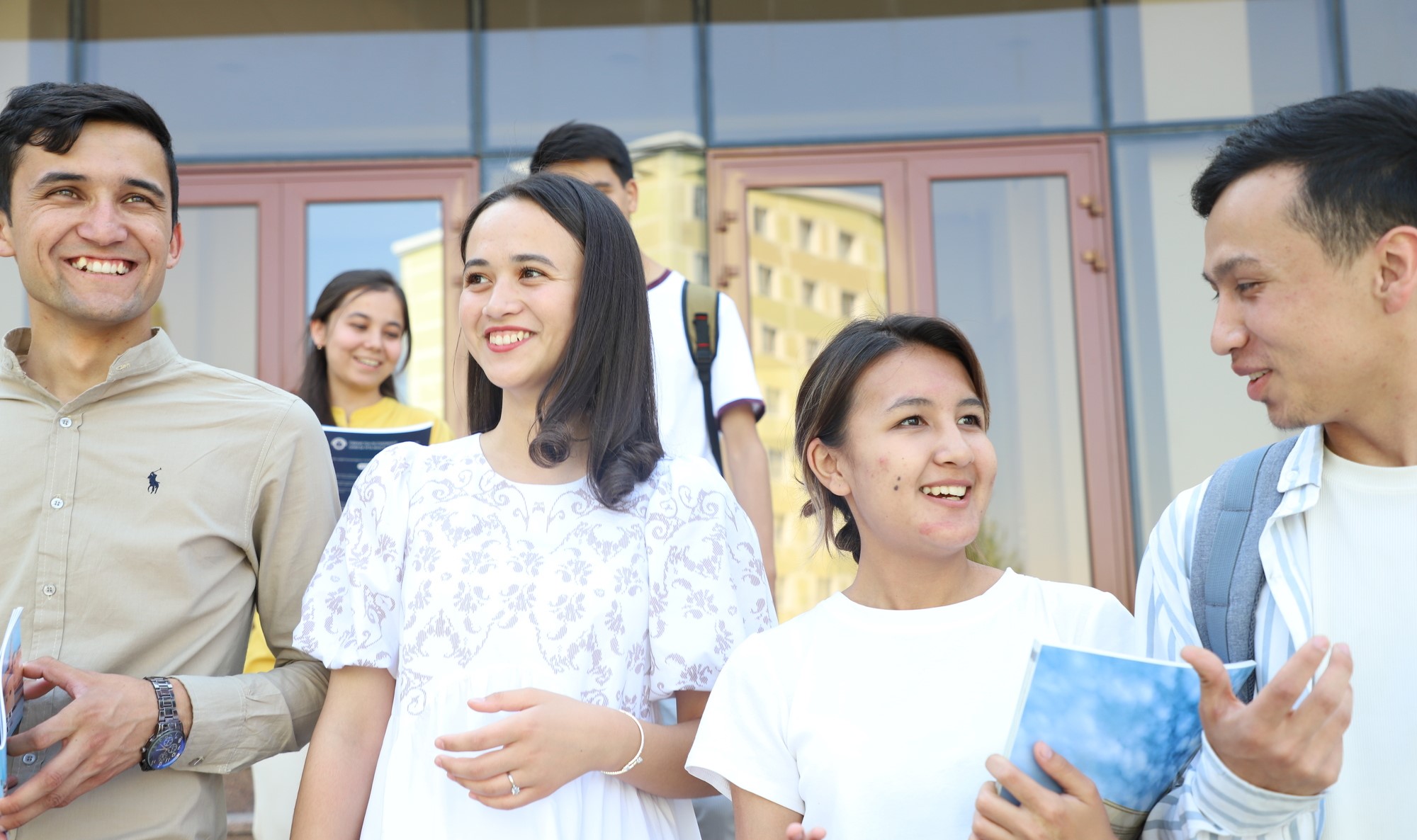 Female student on campus outdoors with a black top 