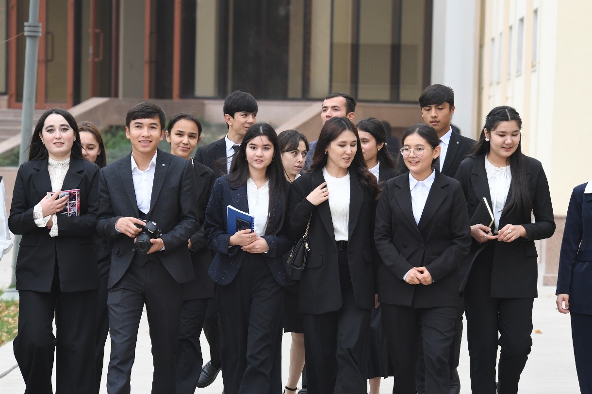 Female student on campus outdoors with a black top 