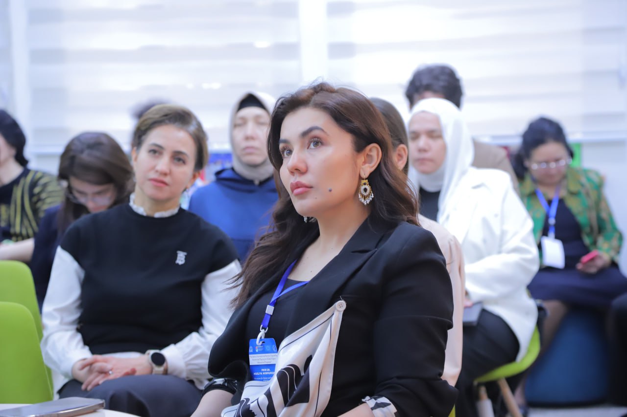 Female student on campus outdoors with a black top 
