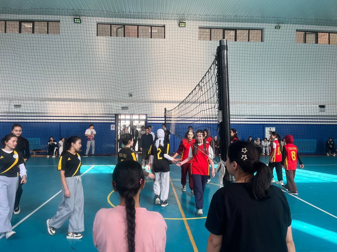 Female student on campus outdoors with a black top 